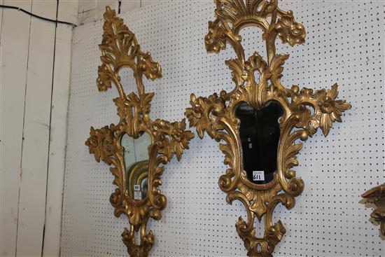 A pair of 20th century Italian carved giltwood cartouche shaped wall mirrors, 3ft 7in. x 2ft 1in.